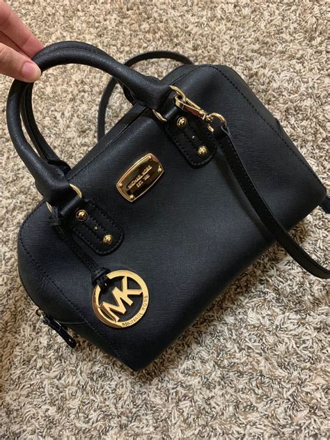 michael kors love purse black and gold|More.